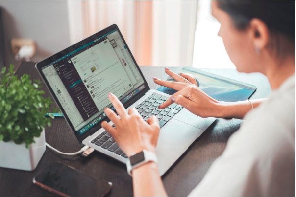 Office worker using a tablet at a desk