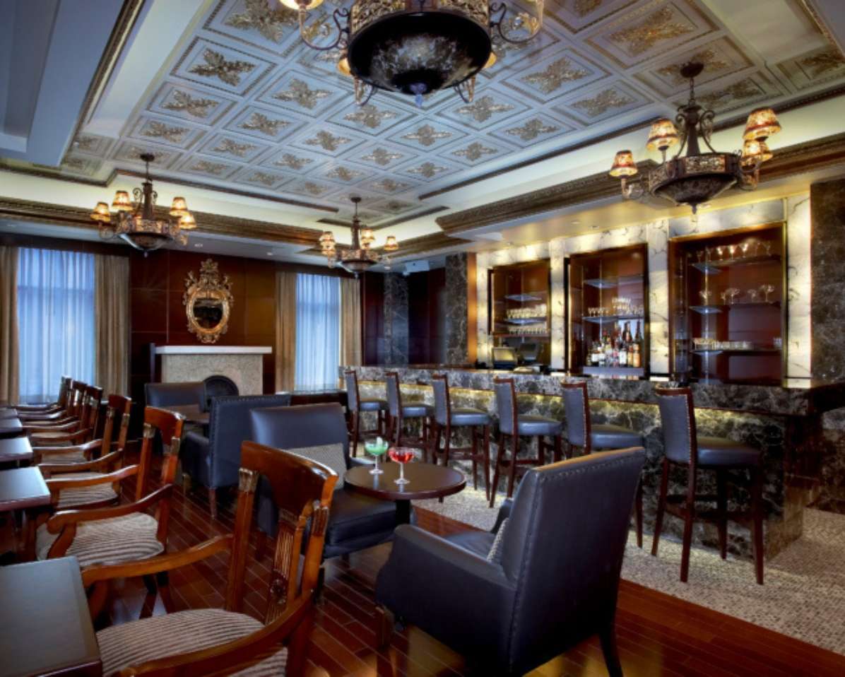 Ornate restaurant interior with decorative ceiling
