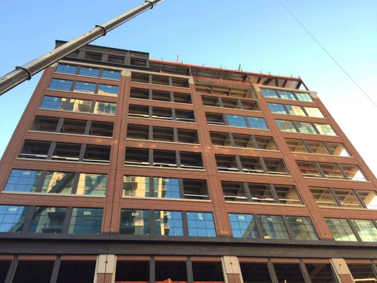 Multi storey building under construction with a tower crane
