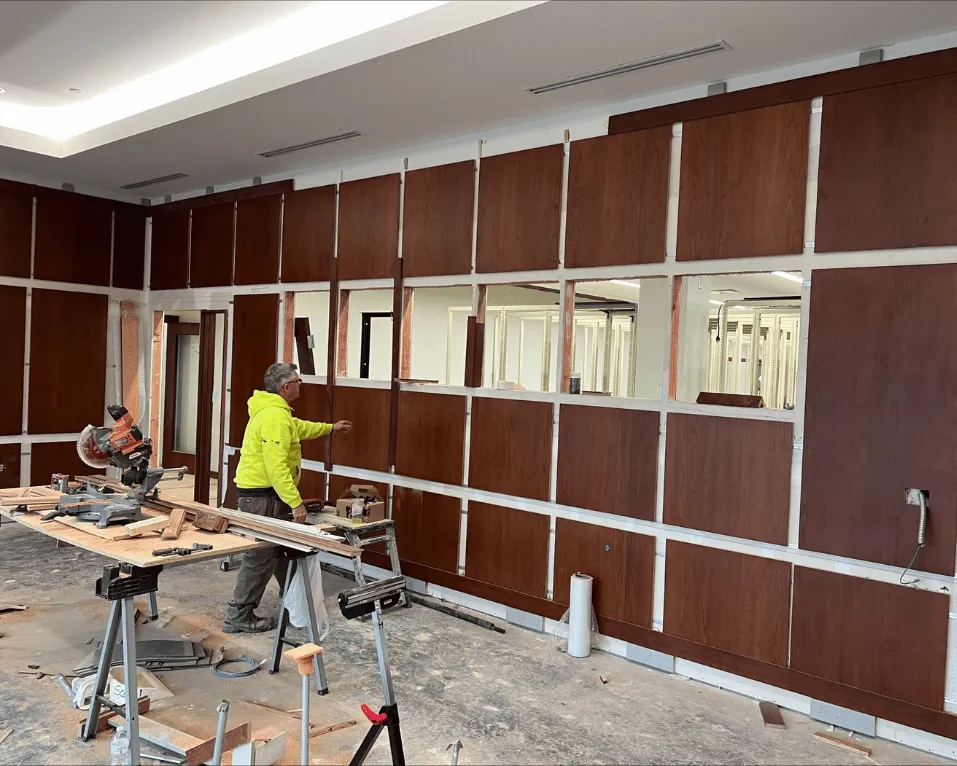 Timber wall panelling being installed