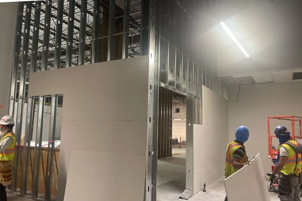 Metal stud partitions being installed in an interior