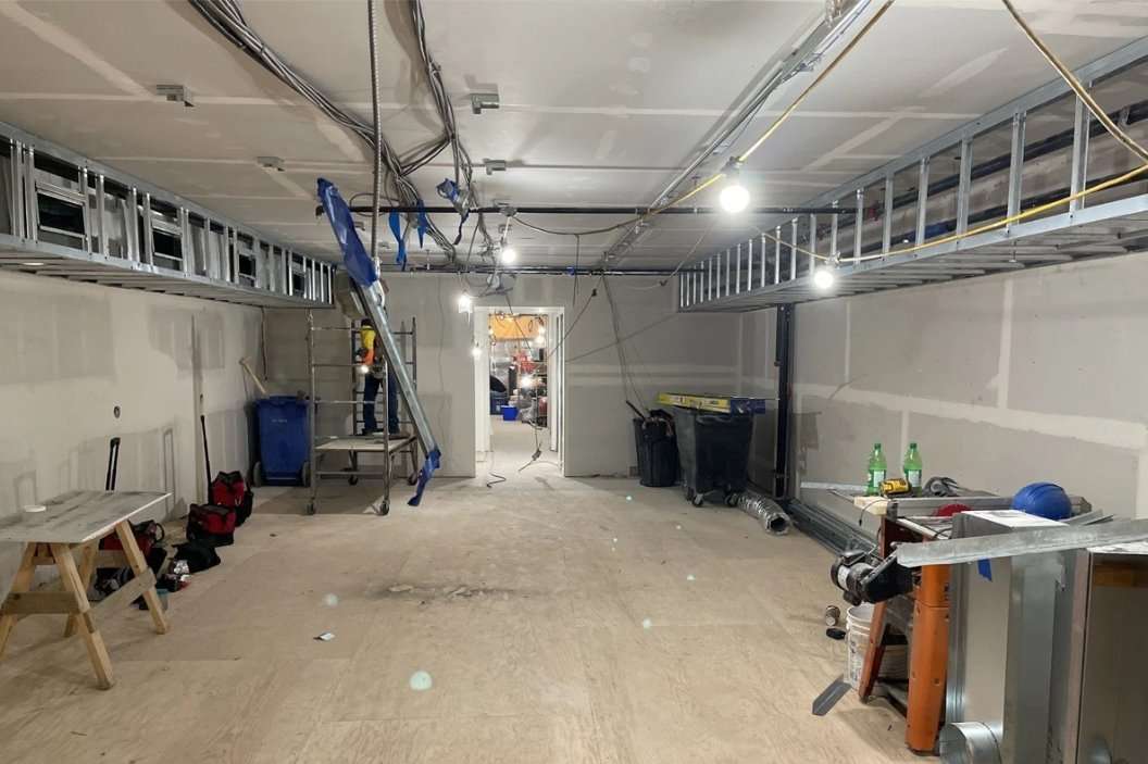 Interior space with exposed services in the ceiling