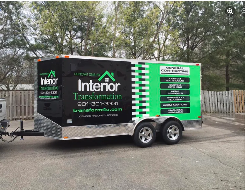 Branded equipment trailer parked at a jobsite