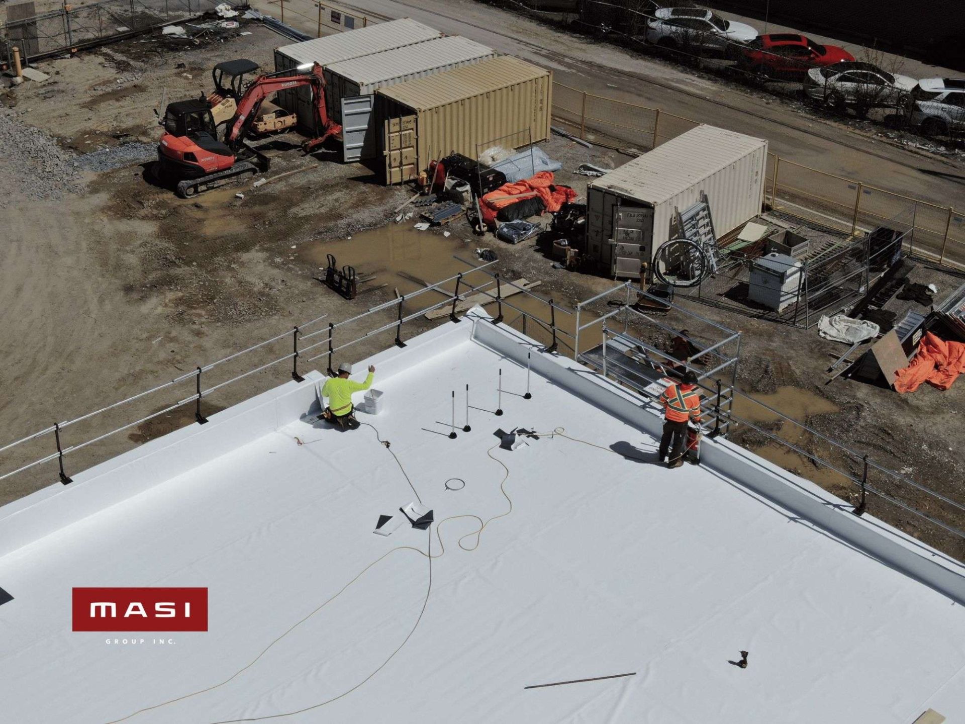 White single ply roof membrane during installation