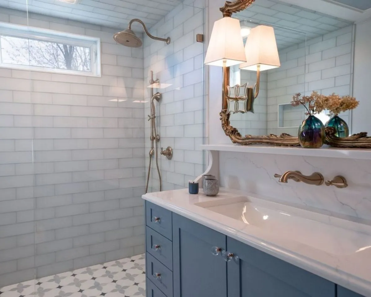 Finished bathroom with tiled walls and vanity