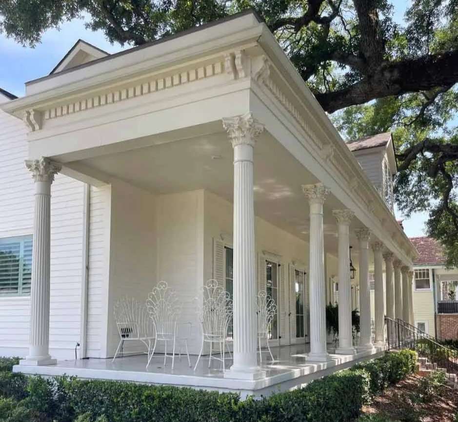 White columned building exterior built by Boudreaux Builders