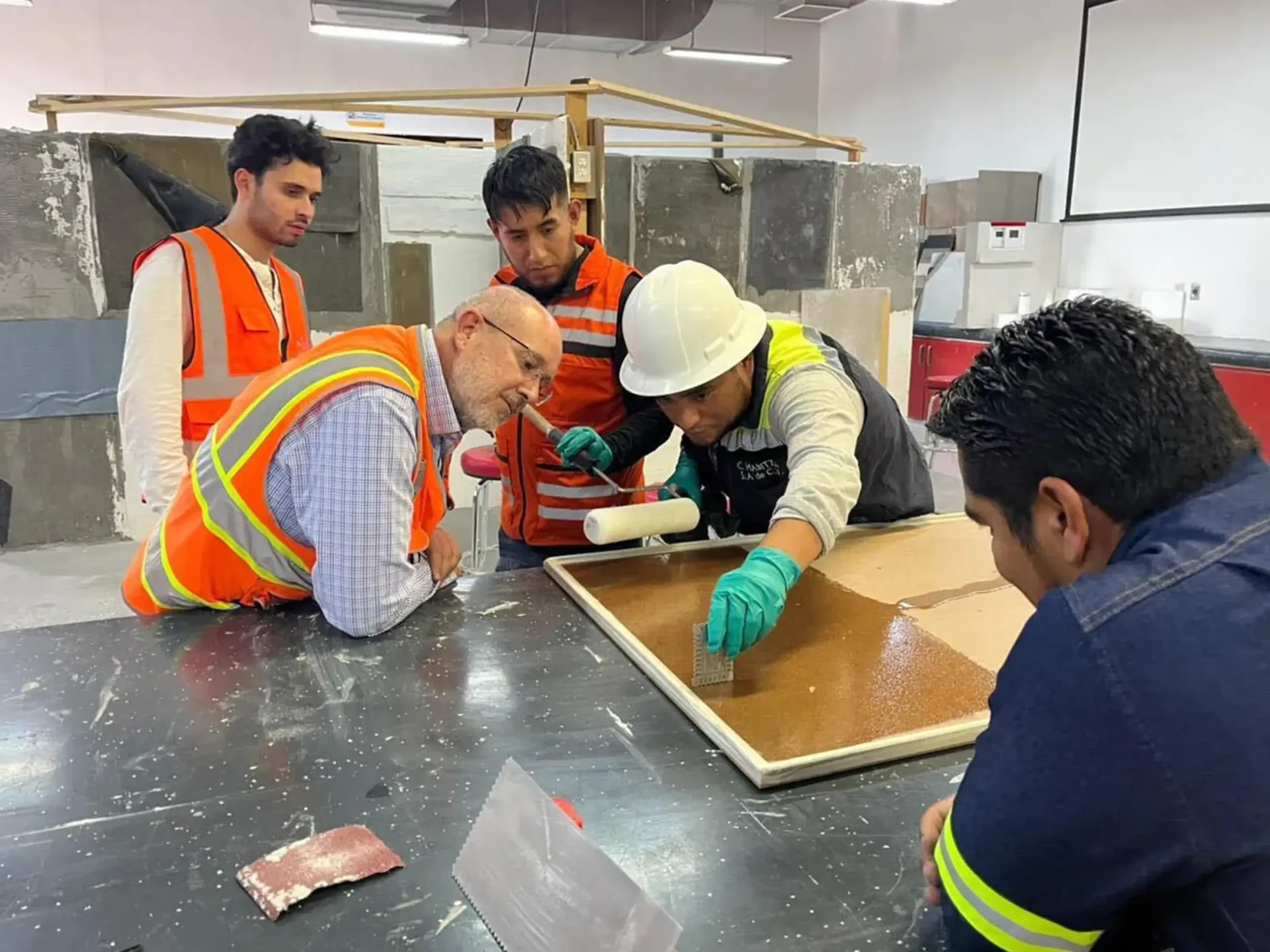 Crew laying flooring inside a building